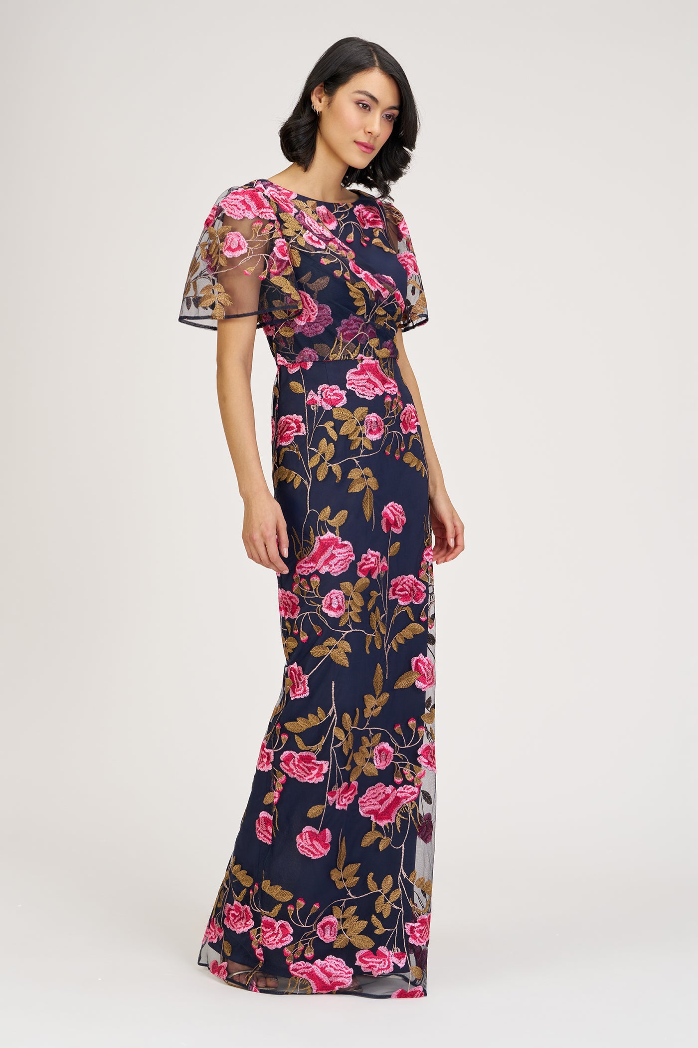 Woman wearing a floral dress on a white background