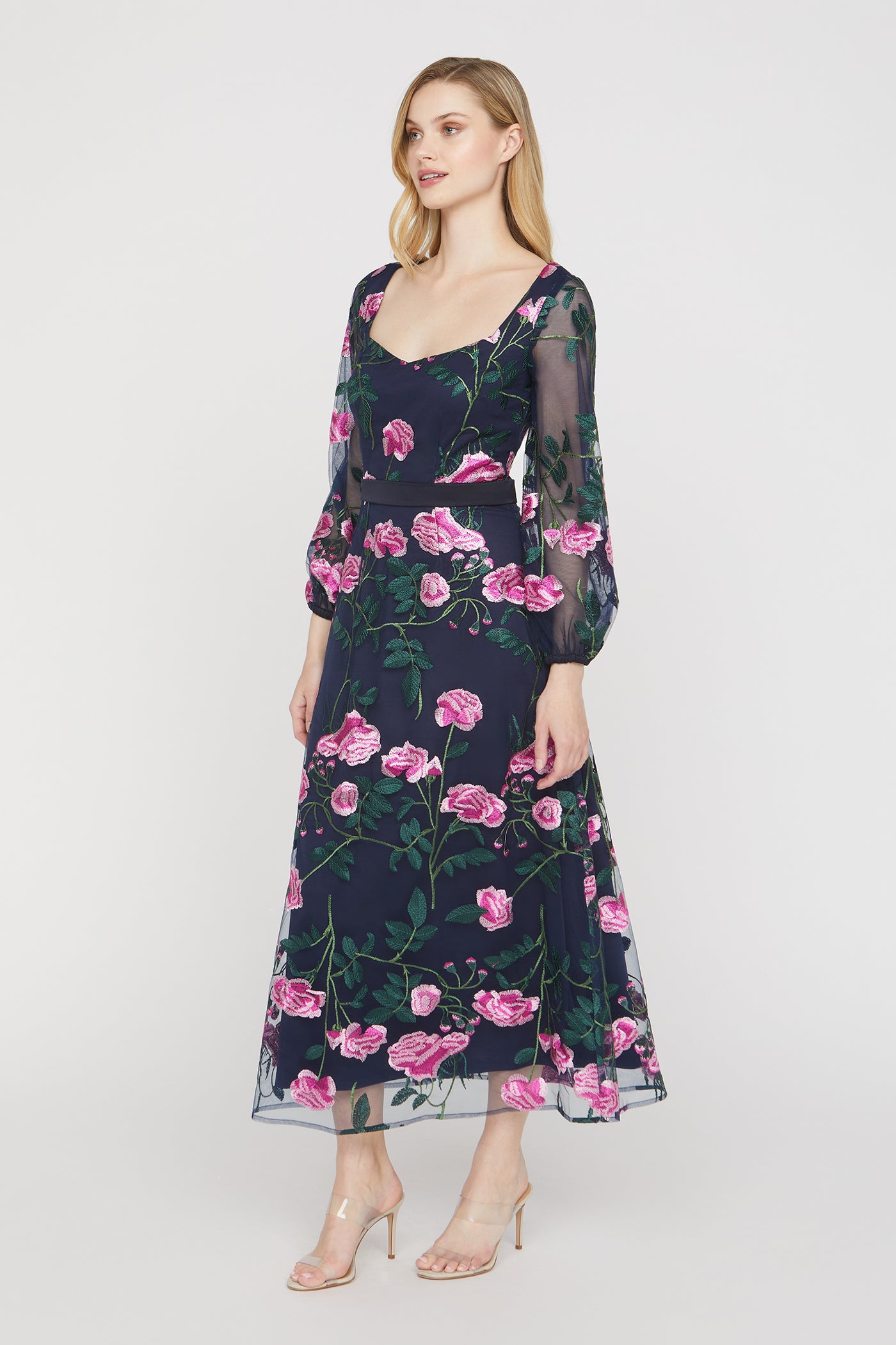 Woman wearing a floral dress on a white background