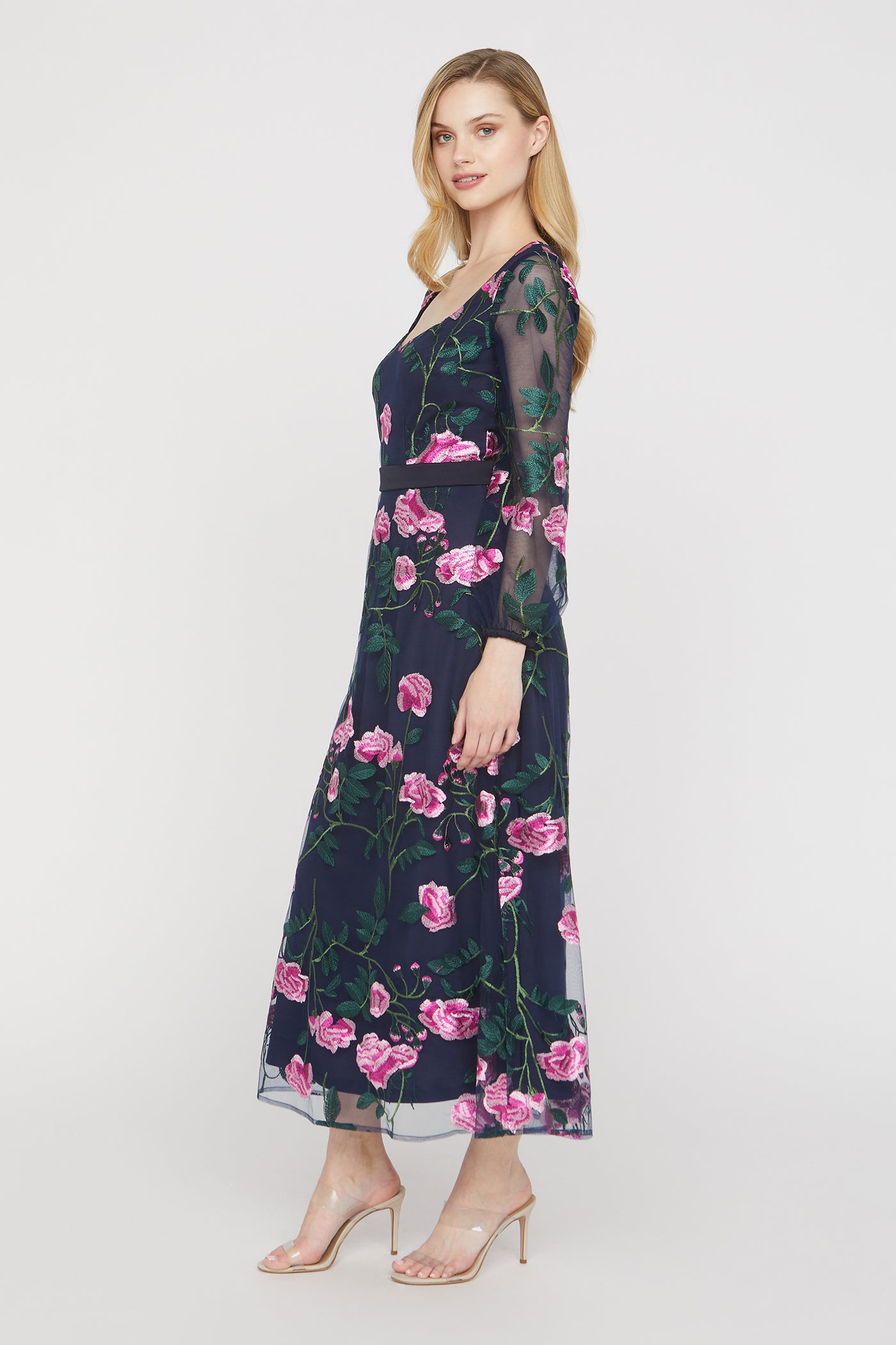 Woman wearing a floral dress on a white background