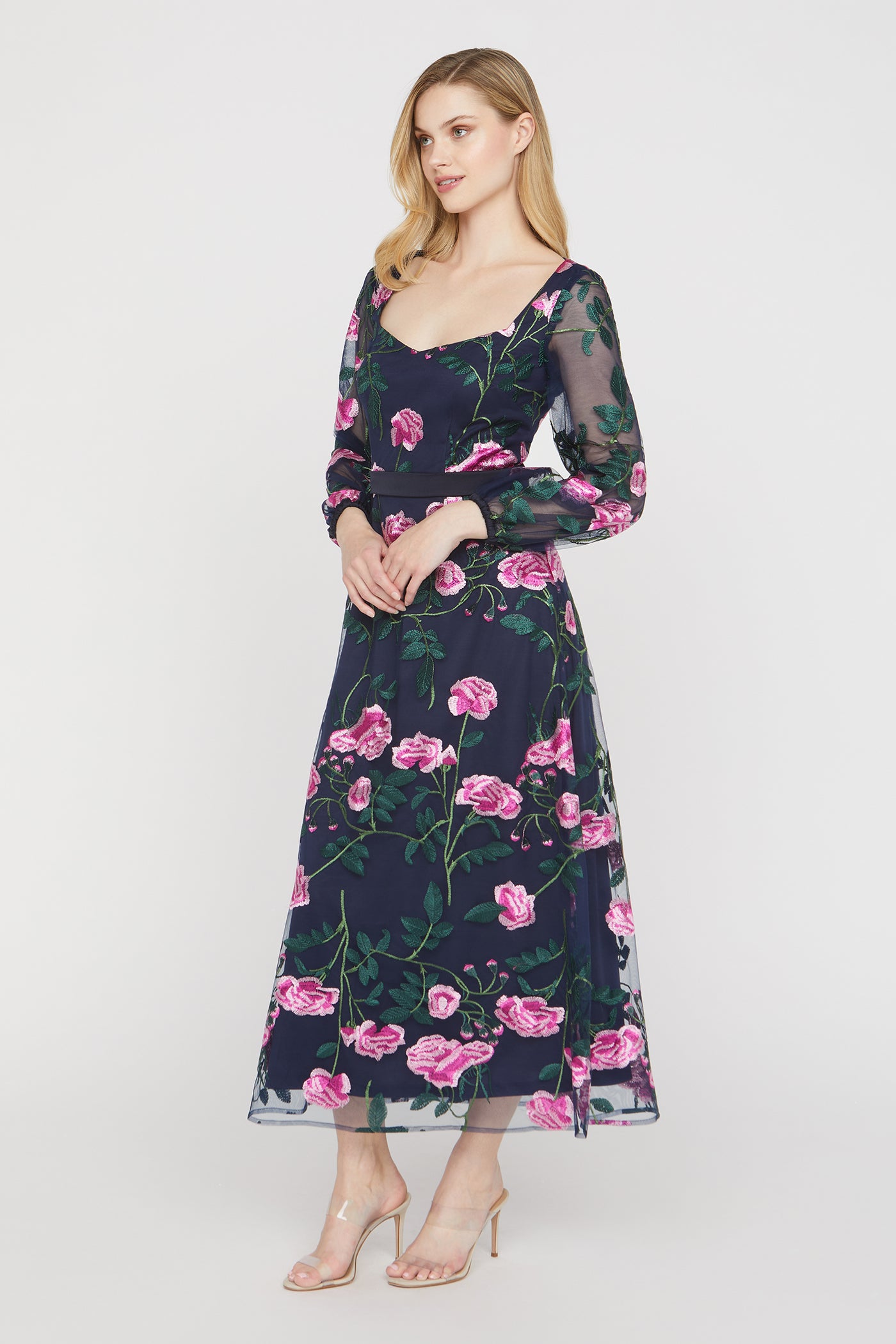 Woman wearing a floral dress on a white background